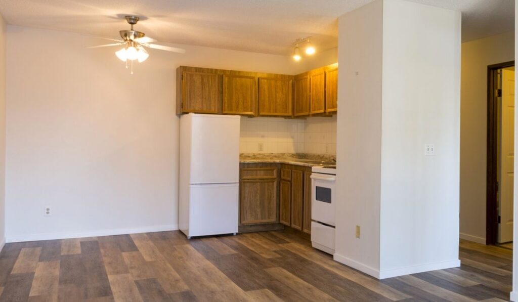 Refrigerator in an empty vacant apartment room