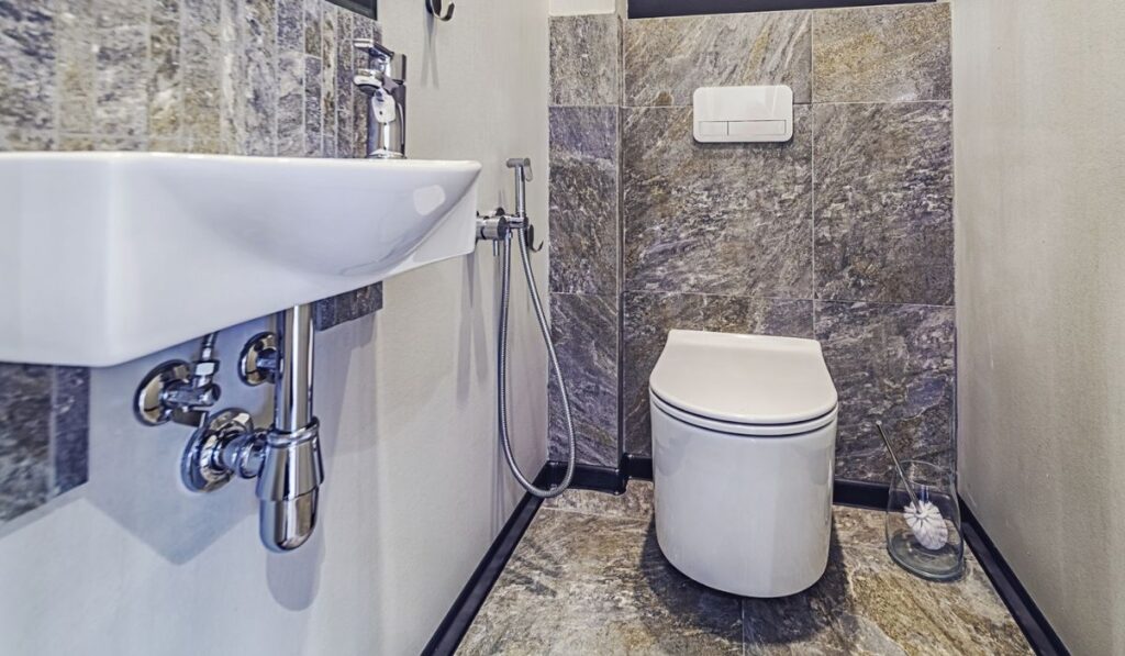 White mounted toilet bowl in modern bathroom