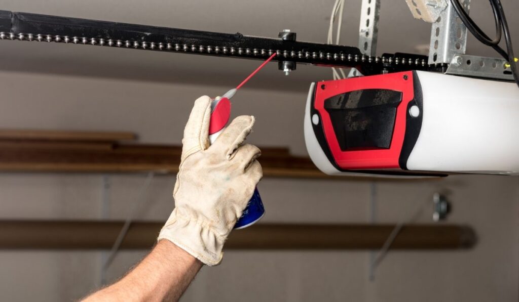 Applying oil to a chain of a garage door opener