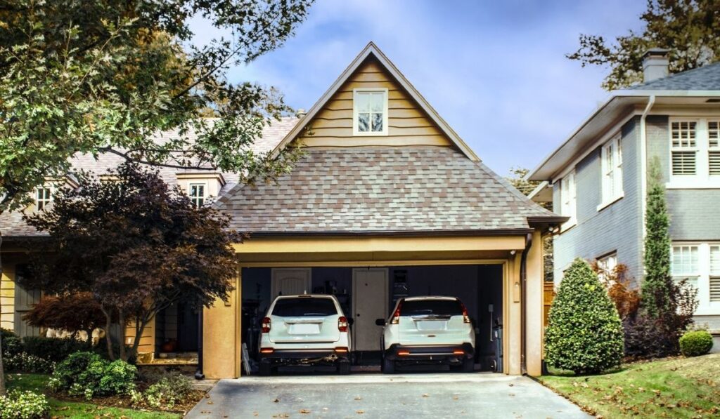 Two car garage open with two white 