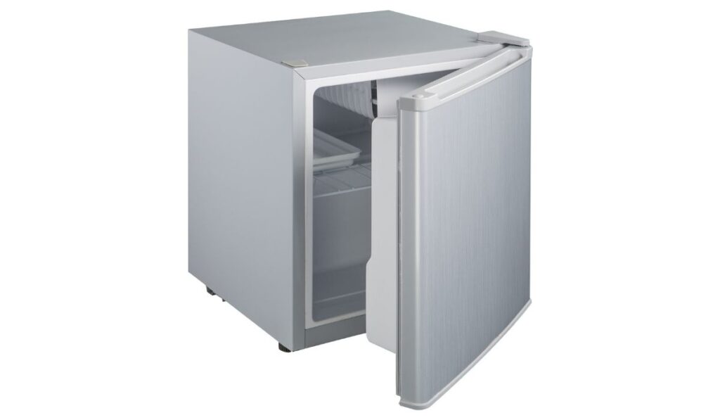 Gray small refrigerator with a closed door on a white background