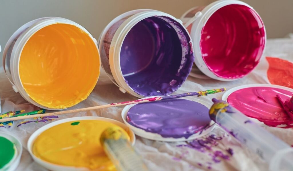 Multi-colored cans on a white background 