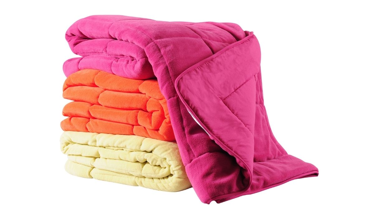 Colorful comforters over white background