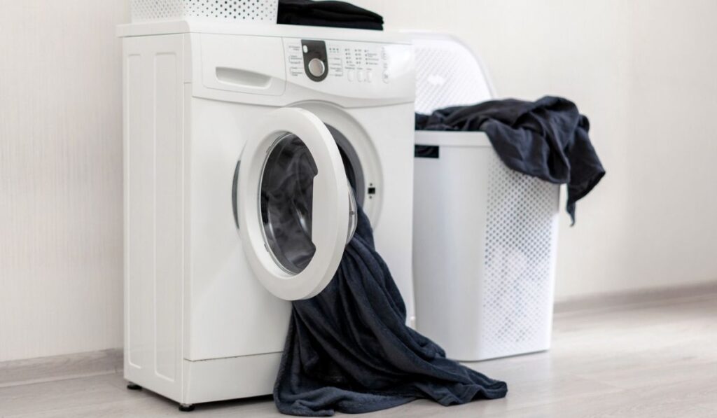 Laundry room interior with washing machine 