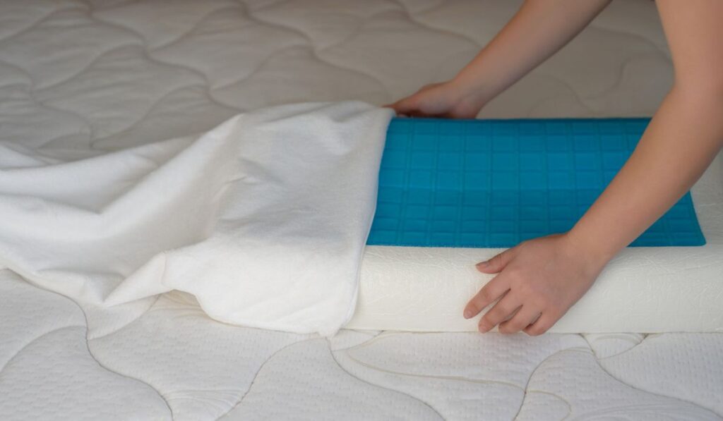 Female hands put a cover on the orthopedic pillow 