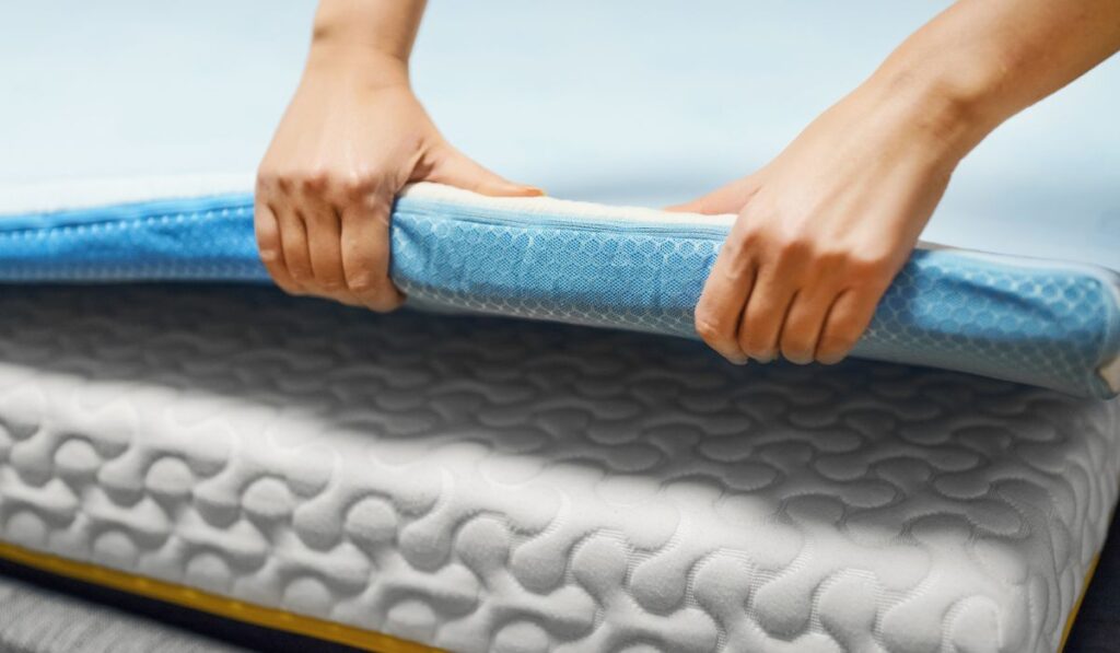 Woman hand testing mattress