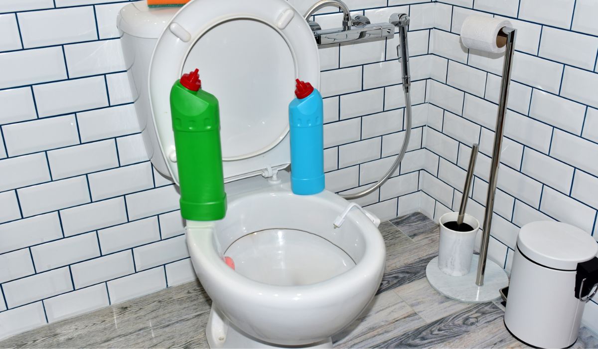 Detergent bottles and sponge for cleaning the toilet in the bathroom in home