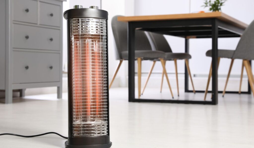 Modern electric heater on floor at home