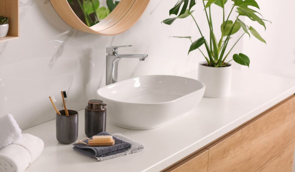 Stylish vessel sink on countertop in modern bathroom