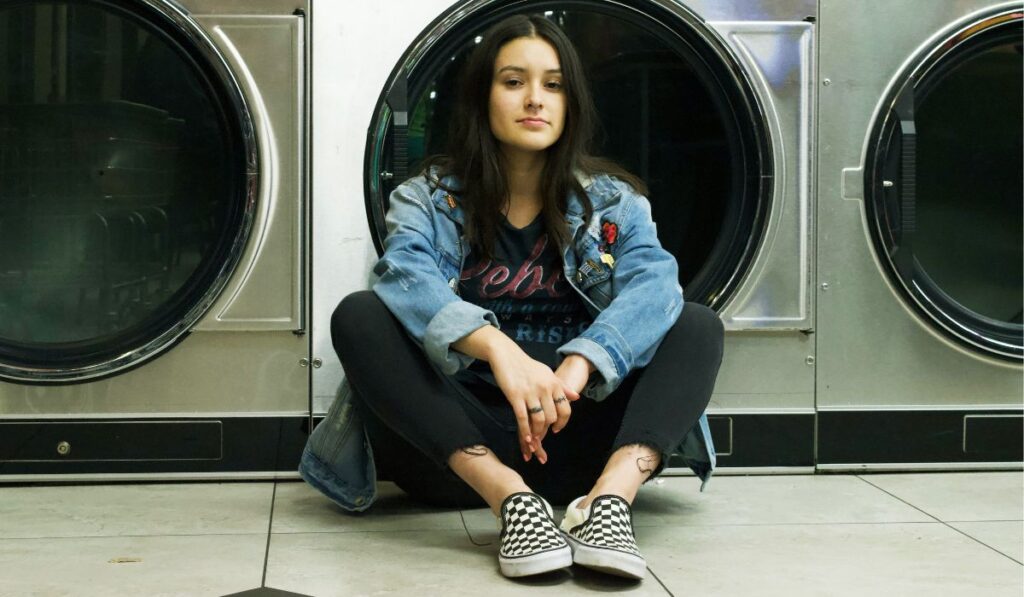 Woman wearing vans near the washing